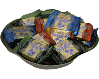 Picture of a candy dish filled with Ghirardelli Squares